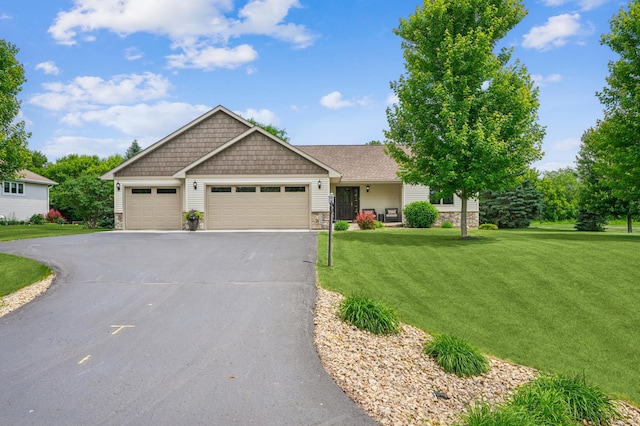1364 Island View Dr, New Richmond, WI 54017 - craftsman-style house featuring stone siding, a front yard, asphalt driveway, and an attached garage