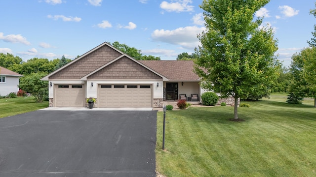 1364 Island View Dr, New Richmond, WI 54017 - craftsman-style house with a front yard, driveway, a garage, and stone siding