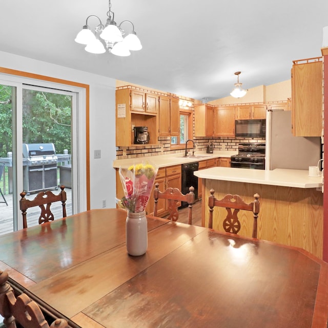 112 3rd St, Luck, WI 54853 - dining area featuring a chandelier and vaulted ceiling