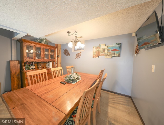 50875 Almond Ave, Nessel Twp, MN 55080 - dining room featuring a chandelier and a textured ceiling