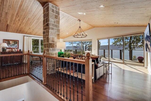 7 3rd St, Pepin, WI 54759 - living room with lofted ceiling, a chandelier, wooden ceiling, and wood finished floors