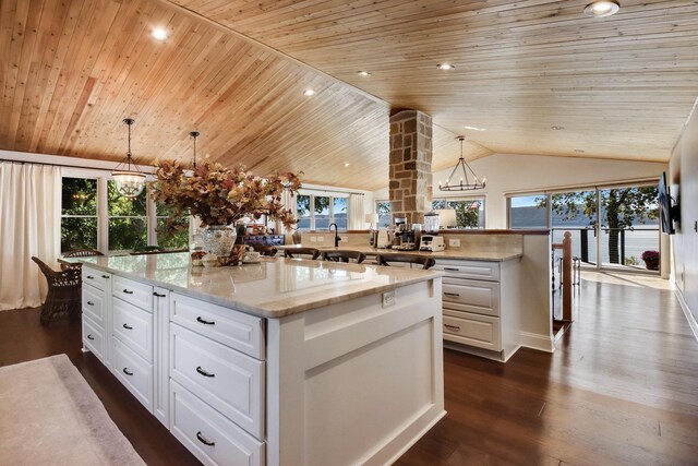 7 3rd St, Pepin, WI 54759 - kitchen with a chandelier, wooden ceiling, lofted ceiling, white cabinetry, and dark wood-type flooring