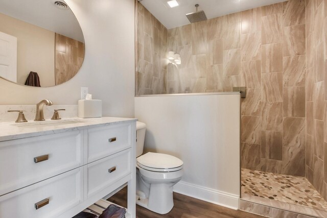 7 3rd St, Pepin, WI 54759 - full bath featuring vanity, walk in shower, and wood finished floors
