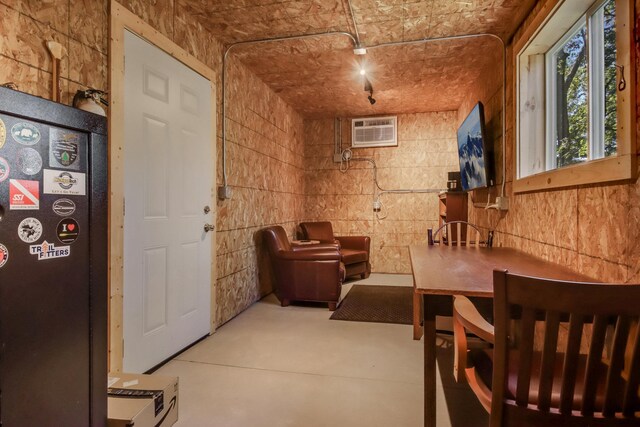 7 3rd St, Pepin, WI 54759 - interior space featuring finished concrete flooring and a wall unit AC