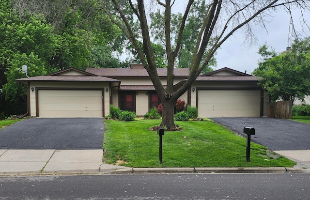 2833 Flag Ave N, New Hope, MN 55427 - view of front of home featuring driveway, a garage, a front lawn, and a shingled roof