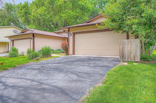 2833 Flag Ave N, New Hope, MN 55427 - view of front facade with asphalt driveway, an attached garage, and a front yard
