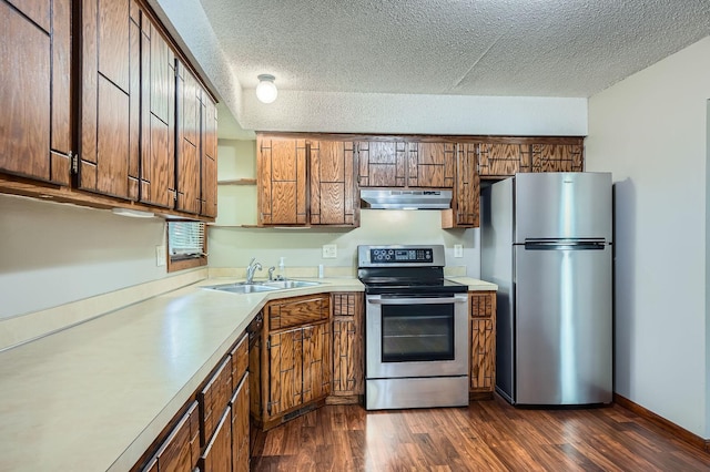 2833 Flag Ave N, New Hope, MN 55427 - kitchen featuring appliances with stainless steel finishes, under cabinet range hood, a textured ceiling, light countertops, and dark wood-style flooring