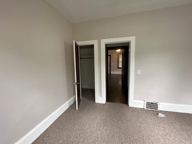 3306 Humboldt Ave N, Minneapolis, MN 55412 - unfurnished bedroom featuring carpet and a closet