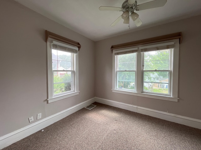 3306 Humboldt Ave N, Minneapolis, MN 55412 - carpeted spare room with baseboards and ceiling fan