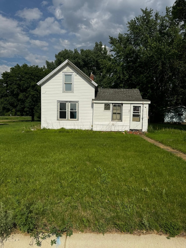 201 Harrison Ave, Sacred Heart, MN 56285 - view of front of property with a front yard and roof with shingles