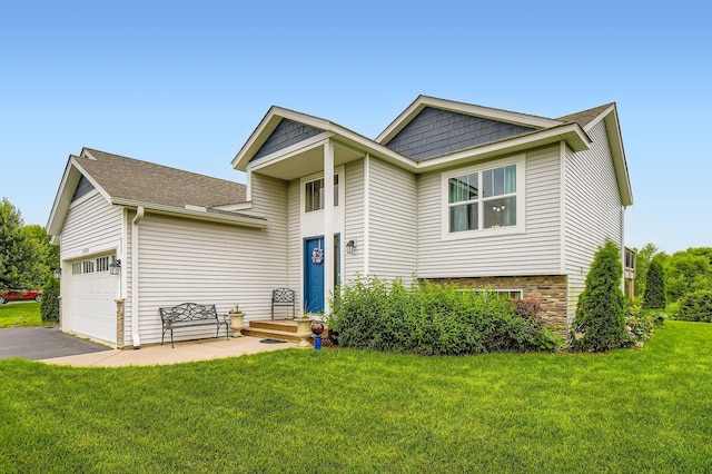 25520 10th St W, Zimmerman, MN 55398 - view of front of home featuring a front yard, driveway, an attached garage, and stone siding