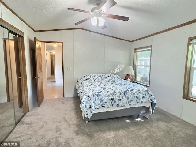 13496 Campfire Cir, South Haven, MN 55382 - carpeted bedroom featuring ornamental molding, a textured ceiling, vaulted ceiling, a closet, and ceiling fan