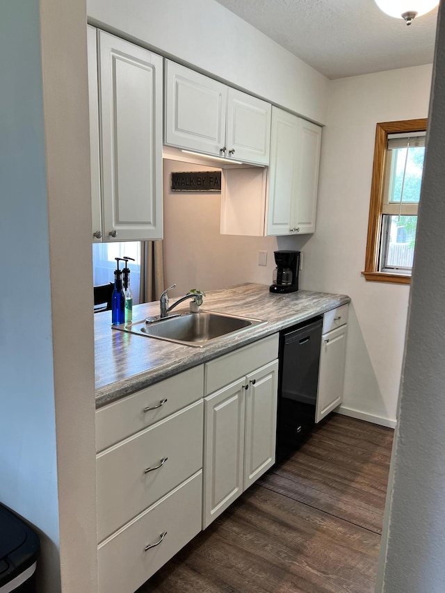 907 22nd Ave S, Moorhead, MN 56560 - kitchen featuring dishwasher, dark wood-type flooring, white cabinets, and light countertops