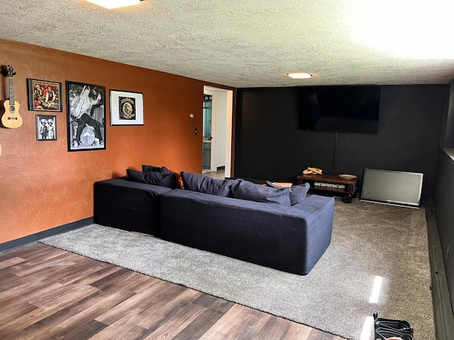 907 22nd Ave S, Moorhead, MN 56560 - living room featuring wood finished floors, a textured ceiling, and a textured wall