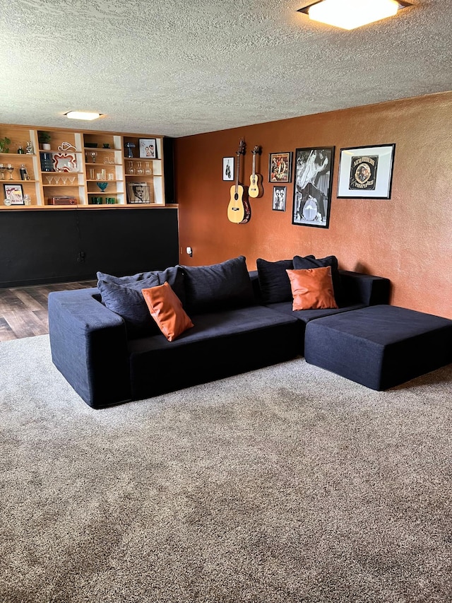 907 22nd Ave S, Moorhead, MN 56560 - living room with a textured ceiling, carpet floors, a textured wall, and wood finished floors