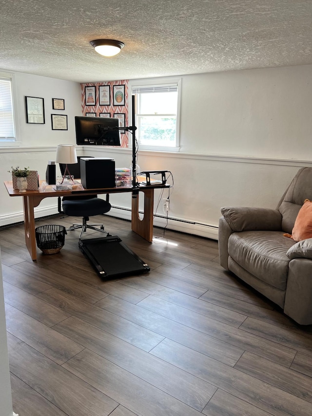 907 22nd Ave S, Moorhead, MN 56560 - office space featuring a baseboard radiator, a textured ceiling, and wood finished floors
