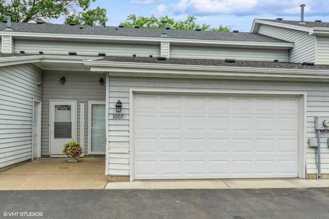 1007 124th Cir NW, Coon Rapids, MN 55448 - garage with driveway