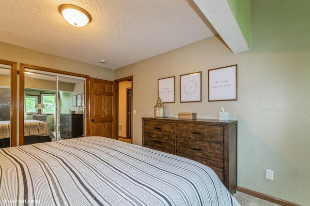 1007 124th Cir NW, Coon Rapids, MN 55448 - carpeted bedroom featuring baseboards and a textured ceiling