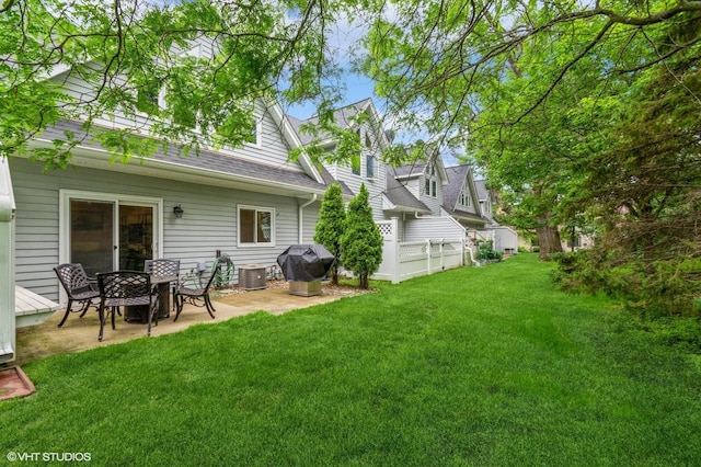 1007 124th Cir NW, Coon Rapids, MN 55448 - view of grassy yard featuring a patio