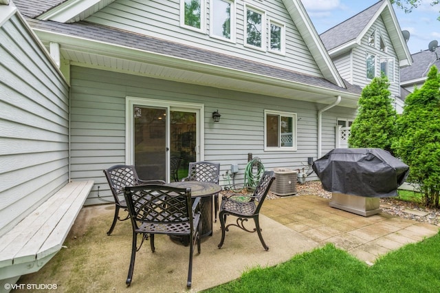 1007 124th Cir NW, Coon Rapids, MN 55448 - view of patio / terrace featuring a grill and outdoor dining space