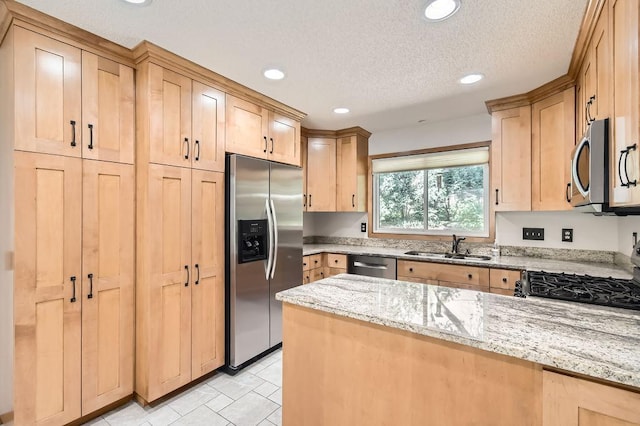 1755 Ranier Ln N, Plymouth, MN 55447 - kitchen with stainless steel appliances, light brown cabinetry, light stone counters, recessed lighting, and a peninsula
