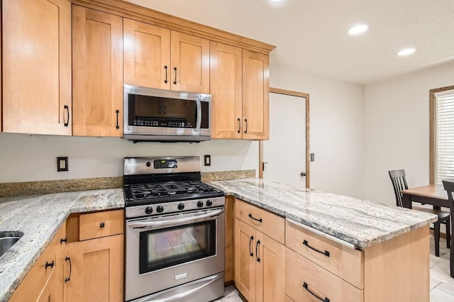 1755 Ranier Ln N, Plymouth, MN 55447 - kitchen featuring stainless steel appliances, a peninsula, light brown cabinets, light stone countertops, and recessed lighting