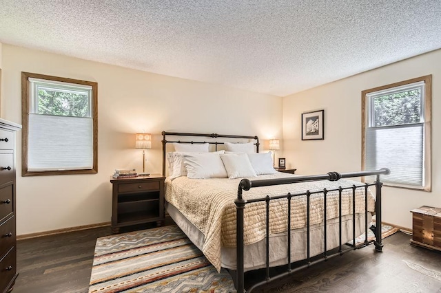 1755 Ranier Ln N, Plymouth, MN 55447 - bedroom featuring dark wood finished floors and a textured ceiling