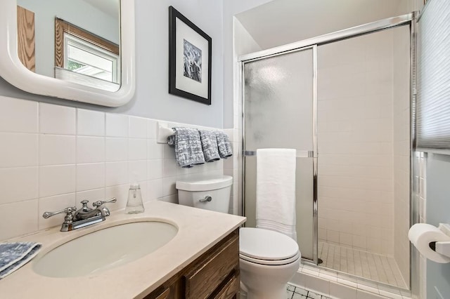 1755 Ranier Ln N, Plymouth, MN 55447 - bathroom with a shower stall, vanity, and tile walls