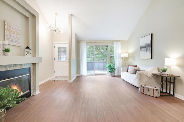 2145 Shenandoah Ct Unit D, Plymouth, MN 55447 - entrance foyer featuring wood finished floors, a chandelier, a tiled fireplace, and high vaulted ceiling