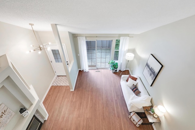 2145 Shenandoah Ct Unit D, Plymouth, MN 55447 - living area featuring a chandelier and light wood-style flooring