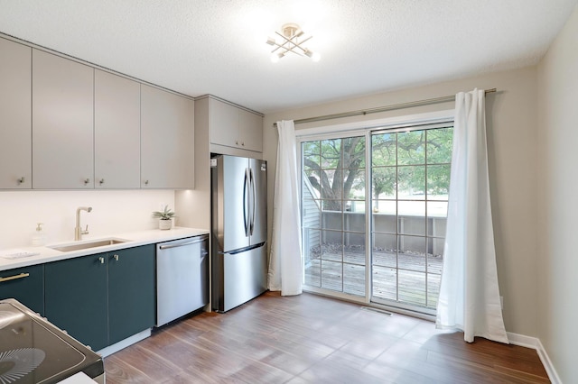 2145 Shenandoah Ct Unit D, Plymouth, MN 55447 - kitchen with stainless steel appliances, light wood-style floors, and light countertops