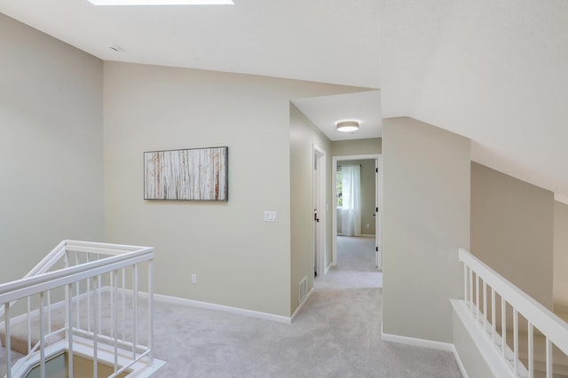 2145 Shenandoah Ct Unit D, Plymouth, MN 55447 - corridor with an upstairs landing, light colored carpet, lofted ceiling, and a skylight