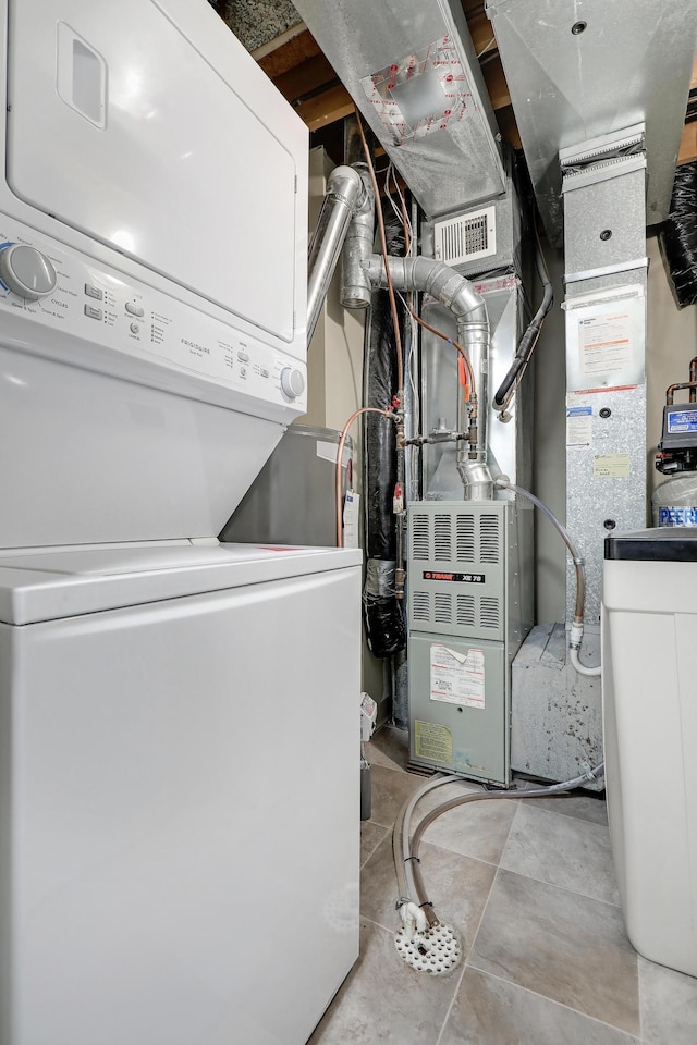 2145 Shenandoah Ct Unit D, Plymouth, MN 55447 - utility room featuring stacked washer and clothes dryer
