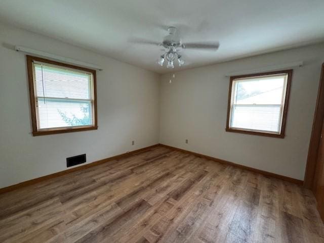 137 20th Ave S, Saint Cloud, MN 56301 - spare room featuring healthy amount of natural light, wood finished floors, and ceiling fan