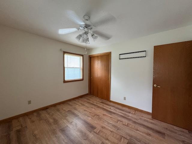 137 20th Ave S, Saint Cloud, MN 56301 - unfurnished bedroom featuring light wood-style flooring, a closet, and ceiling fan
