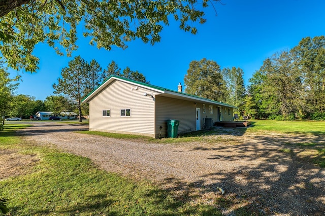 329 Kelliher Rd SW, Kelliher, MN 56650 - view of home's exterior featuring a central air condition unit and a yard