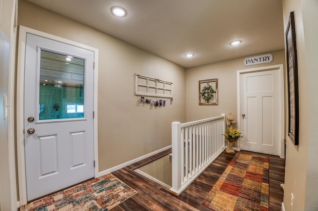 329 Kelliher Rd SW, Kelliher, MN 56650 - foyer entrance with dark wood finished floors and recessed lighting