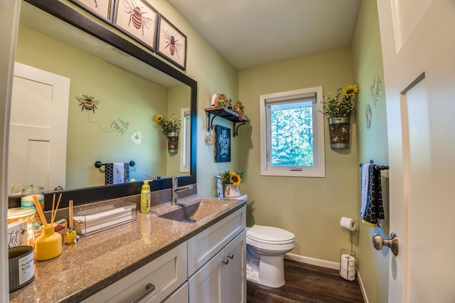 329 Kelliher Rd SW, Kelliher, MN 56650 - bathroom featuring wood finished floors and vanity