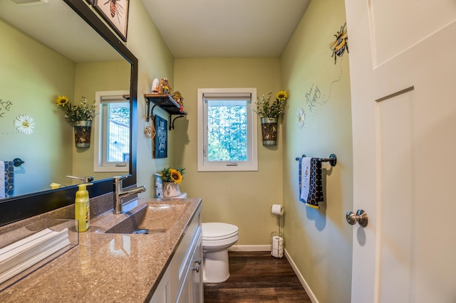 329 Kelliher Rd SW, Kelliher, MN 56650 - half bath featuring vanity and wood finished floors