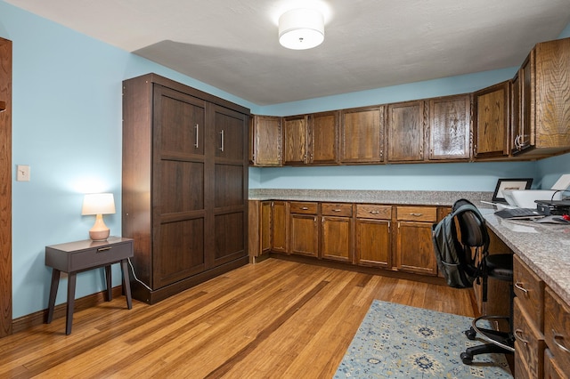 8544 Demontreville Trl N, Lake Elmo, MN 55042 - office area with built in desk and light wood-style floors