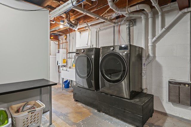 8544 Demontreville Trl N, Lake Elmo, MN 55042 - laundry room featuring washer and clothes dryer, concrete block wall, and tankless water heater