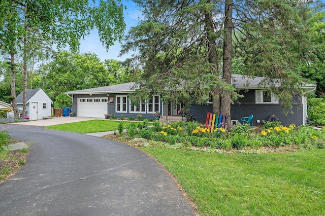 8544 Demontreville Trl N, Lake Elmo, MN 55042 - view of front of house with driveway, brick siding, a front lawn, and an attached garage
