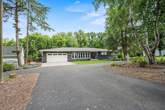 8544 Demontreville Trl N, Lake Elmo, MN 55042 - view of front facade with driveway and a garage