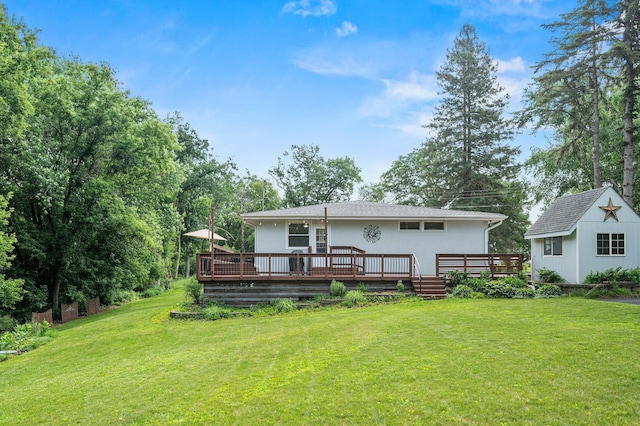 8544 Demontreville Trl N, Lake Elmo, MN 55042 - rear view of house featuring a yard, a deck, and an outbuilding