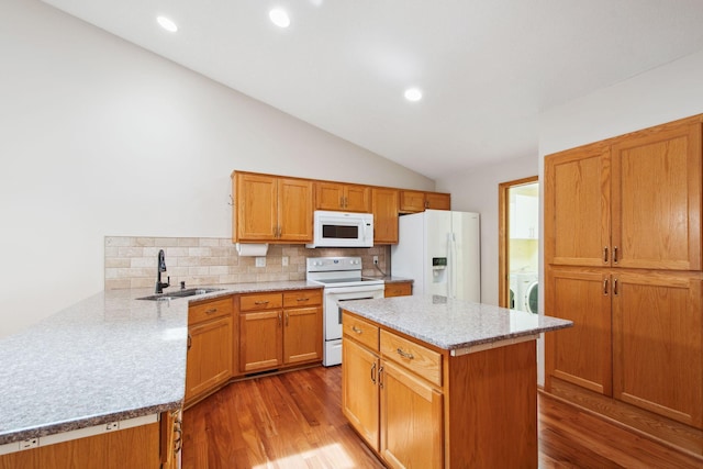 14208 Heritage Ln, Apple Valley, MN 55124 - kitchen featuring white appliances, dark wood-style floors, decorative backsplash, lofted ceiling, and light stone countertops