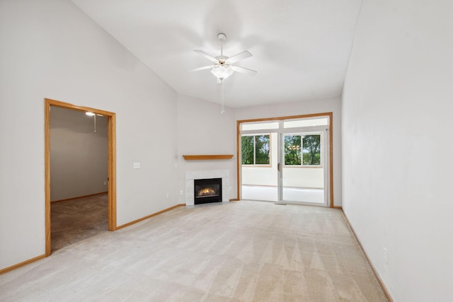 14208 Heritage Ln, Apple Valley, MN 55124 - unfurnished living room with light carpet, ceiling fan, a tiled fireplace, and lofted ceiling