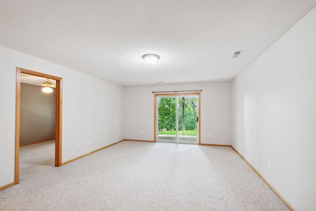 14208 Heritage Ln, Apple Valley, MN 55124 - carpeted empty room featuring baseboards and a textured ceiling