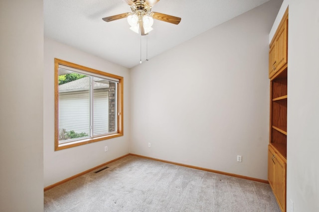 14208 Heritage Ln, Apple Valley, MN 55124 - unfurnished room with light carpet and a ceiling fan
