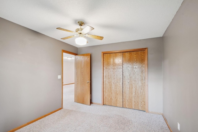 14208 Heritage Ln, Apple Valley, MN 55124 - unfurnished bedroom with carpet floors, a closet, ceiling fan, and a textured ceiling