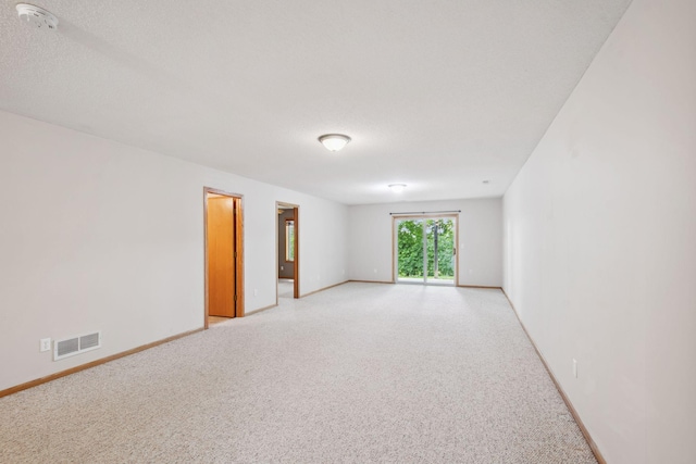 14208 Heritage Ln, Apple Valley, MN 55124 - spare room with light carpet and a smoke detector
